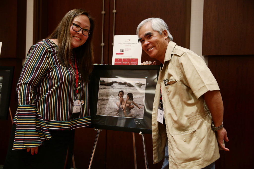 Nick's photo that Doris bought in the Silent Auction with Doris Truong and Nick Ut. Photo by Alex Wong